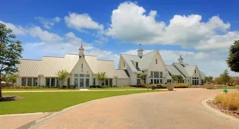 an aerial view of residential building and lake