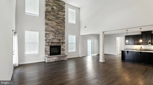 a view of a kitchen with a sink and a refrigerator