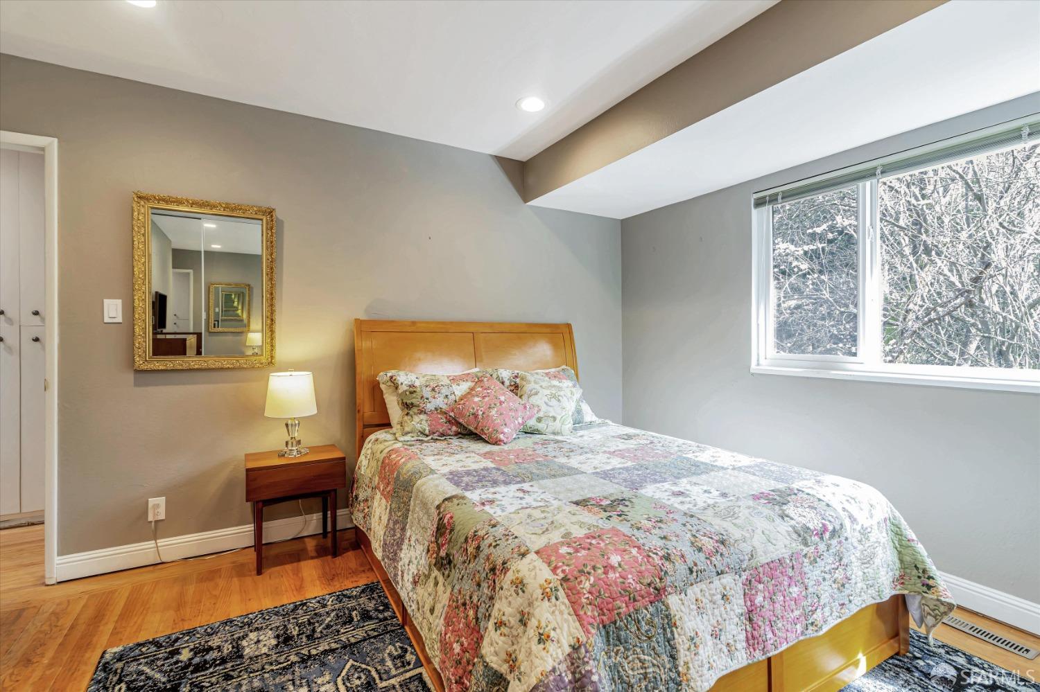 3 Harran Circle Orinda, CA 94563 - Photo 16 of 34 a bedroom with a bed and a lamp with window