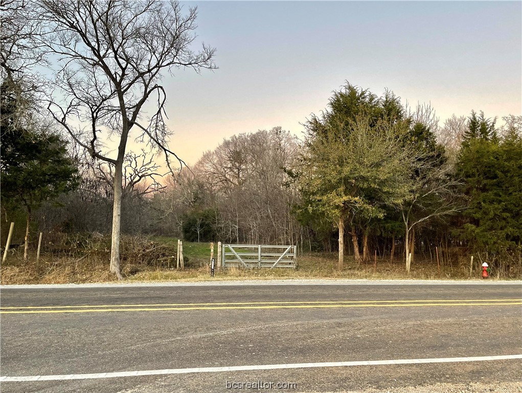 3360 Sandy Point Road Bryan, TX 77807 - Photo 1 of 1 a view of a building and trees