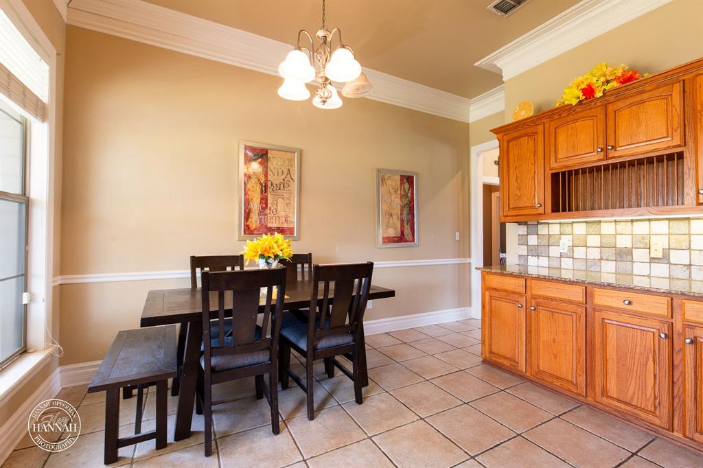6531 North Liberty Way Keithville, LA 71047 - Photo 11 of 28 a view of a dining room with furniture and chandelier