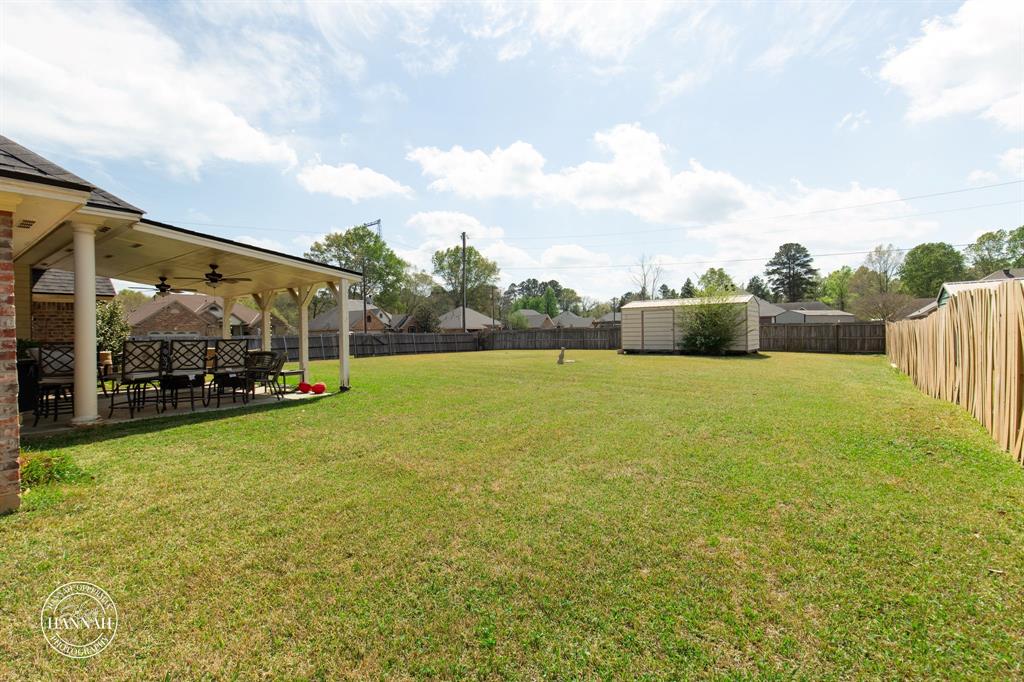 6531 North Liberty Way Keithville, LA 71047 - Photo 26 of 28 a view of yard with swimming pool and green space