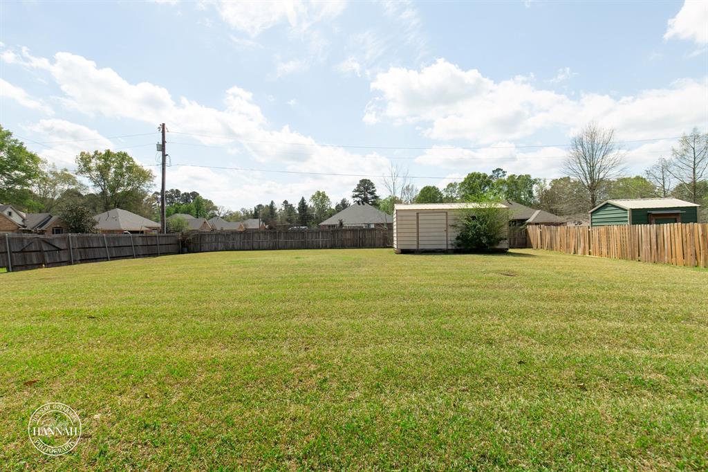 6531 North Liberty Way Keithville, LA 71047 - Photo 27 of 28 a view of a garden and basketball court