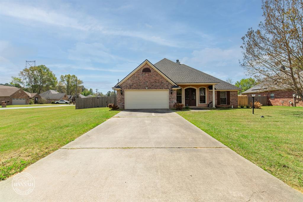 6531 North Liberty Way Keithville, LA 71047 - Photo 3 of 28 a front view of a house with a yard
