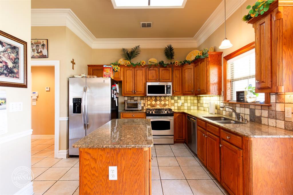 6531 North Liberty Way Keithville, LA 71047 - Photo 8 of 28 a kitchen with refrigerator and cabinets