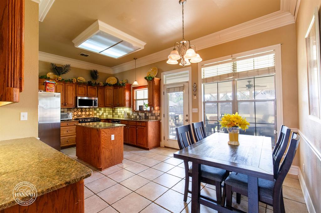 6531 North Liberty Way Keithville, LA 71047 - Photo 10 of 28 a view of a dining room with furniture a chandelier and wooden floor