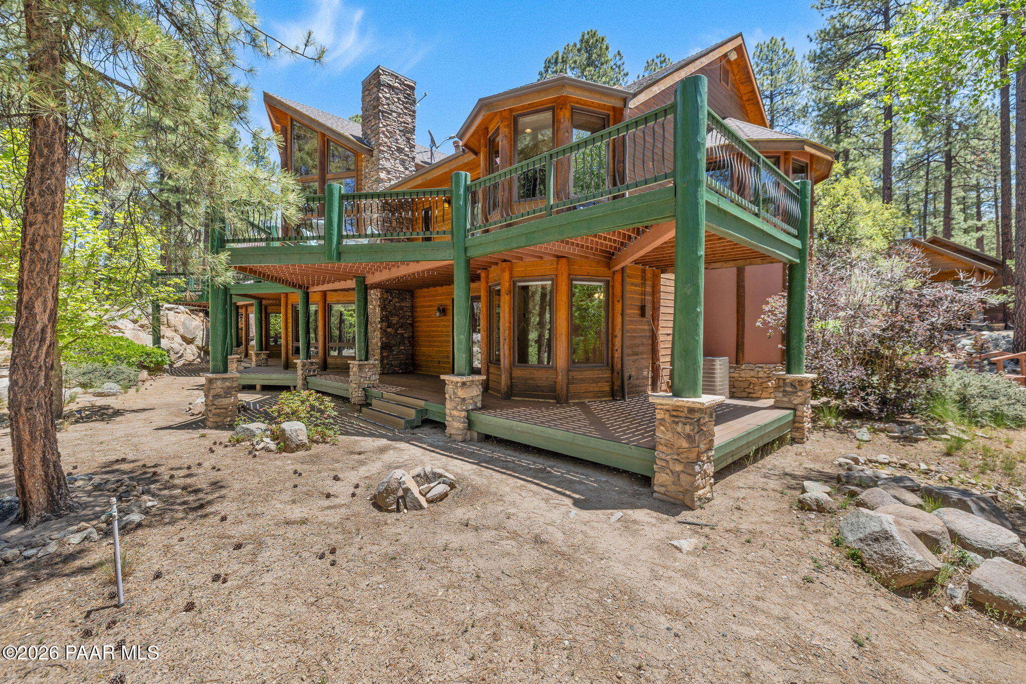 5140 East Charcoal Kiln Road Prescott, AZ 86303 - Photo 107 of 140 a view of a building with a bench in front of house