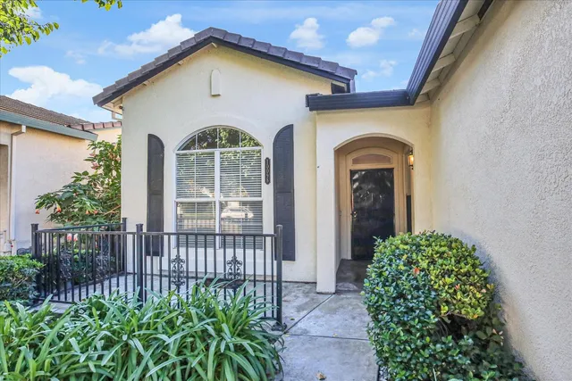 a front view of a house with garden