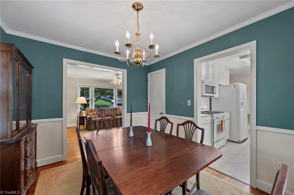 1127 Pinebluff Road Winston-Salem, NC 27103 - Photo 5 of 24 The dining room with a view of the living room, and the kitchen to the right
