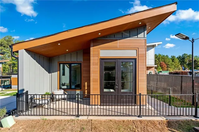 a balcony with furniture and flowers