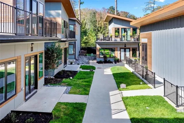 a front view of a house with a yard table and chairs