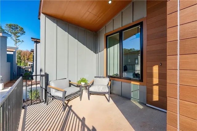 a view of porch with a chair and a potted plant