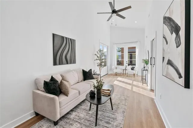 a living room with furniture and a potted plant
