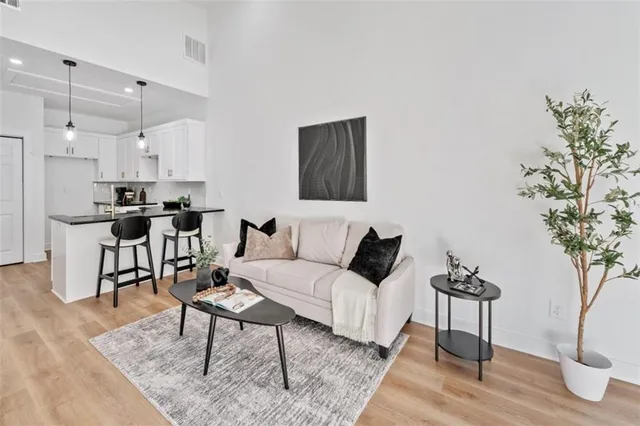 a kitchen with stainless steel appliances granite countertop a sink a refrigerator and a granite counter tops