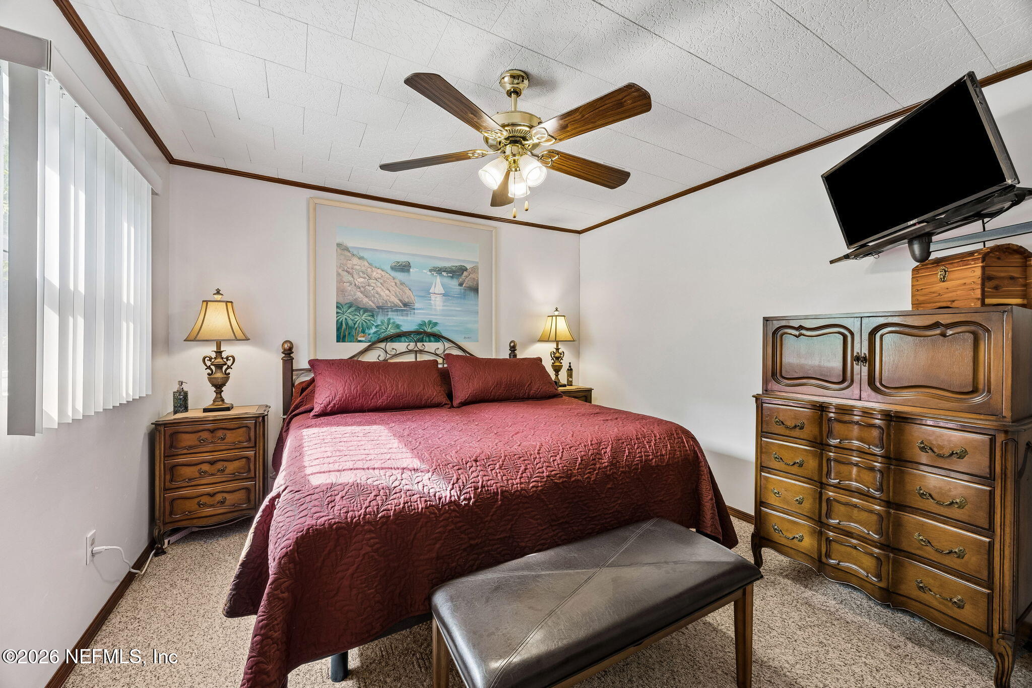 110 Shaffer Avenue Crescent City, FL 32112 - Photo 12 of 44 a bedroom with a bed and a chandelier
