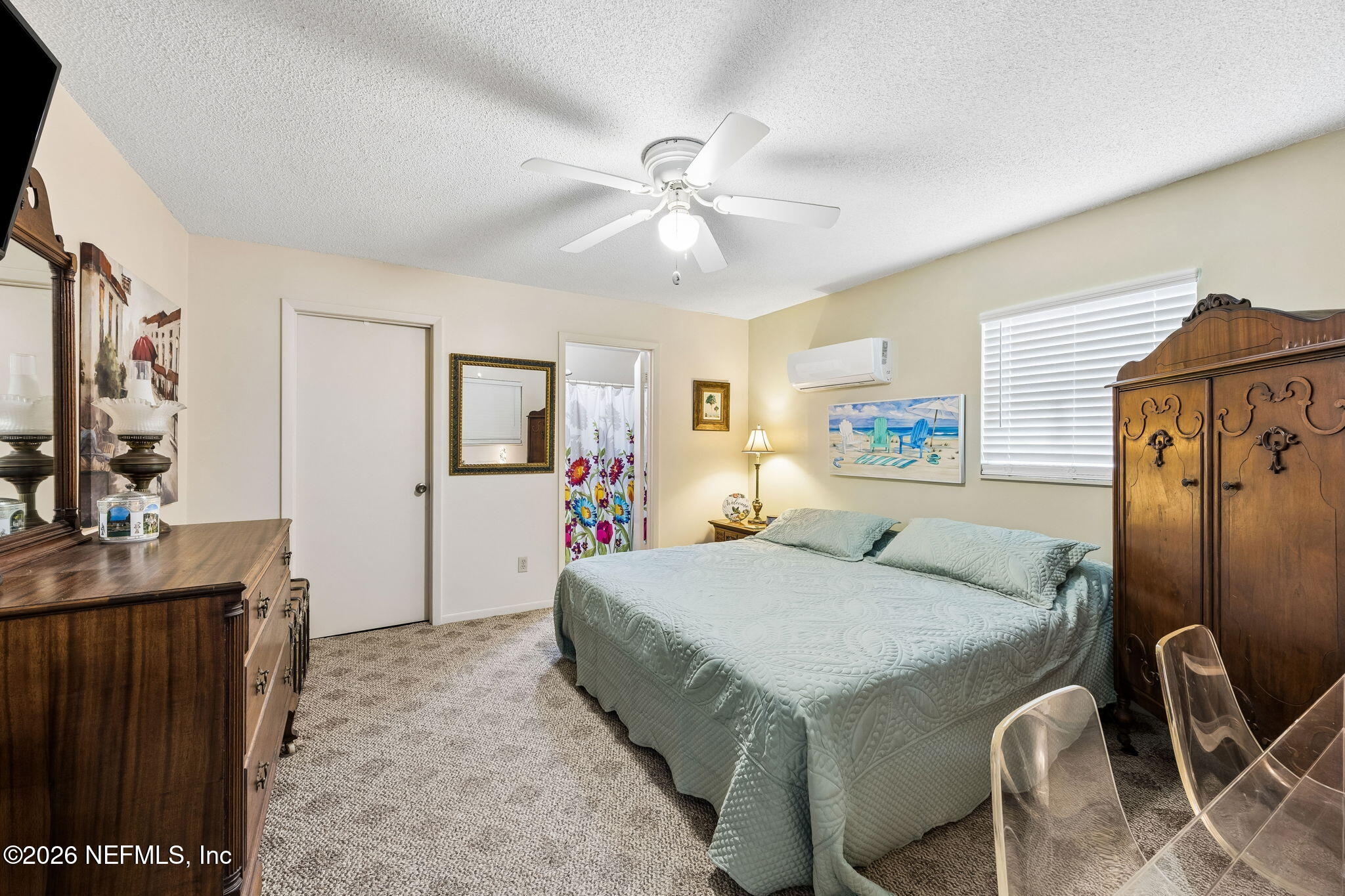 110 Shaffer Avenue Crescent City, FL 32112 - Photo 16 of 44 a bedroom with a bed and a chandelier