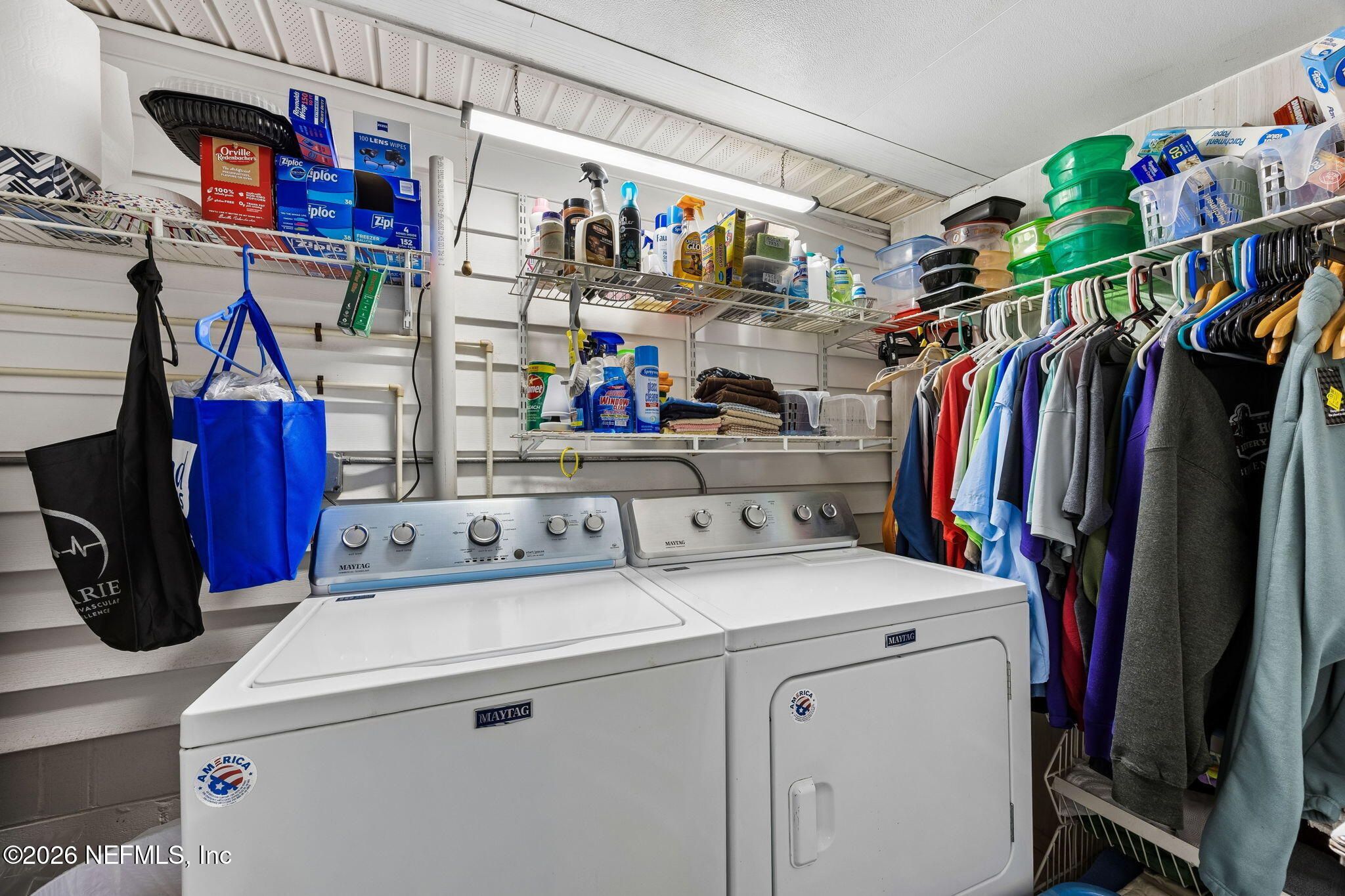 110 Shaffer Avenue Crescent City, FL 32112 - Photo 20 of 44 a view of walk in closet with clothes and shoes