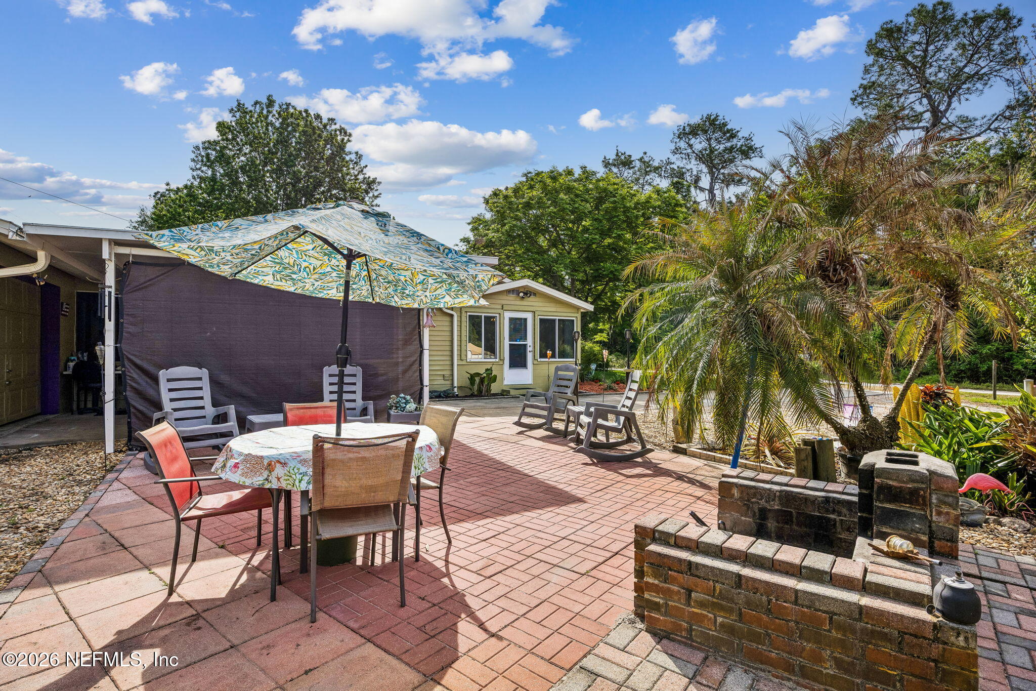 110 Shaffer Avenue Crescent City, FL 32112 - Photo 23 of 44 a view of a patio with table and chairs under an umbrella