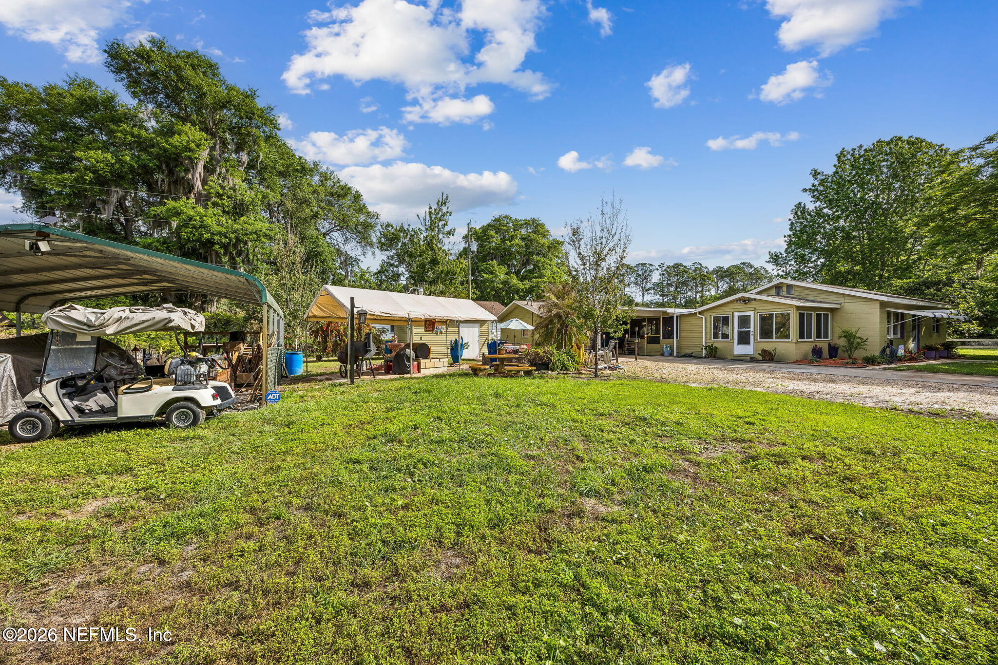 110 Shaffer Avenue Crescent City, FL 32112 - Photo 26 of 44 a view of a house with a big yard and sitting area