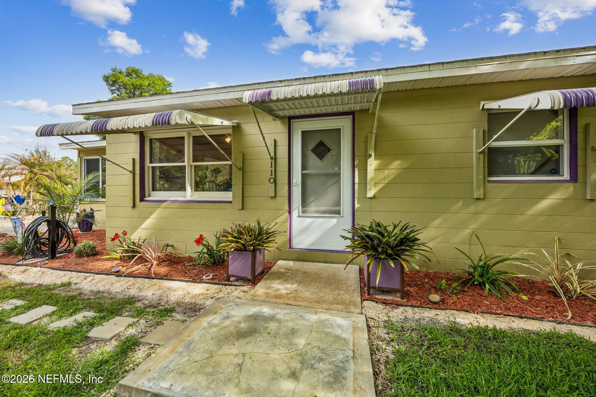 110 Shaffer Avenue Crescent City, FL 32112 - Photo 3 of 44 a front view of a house with a yard