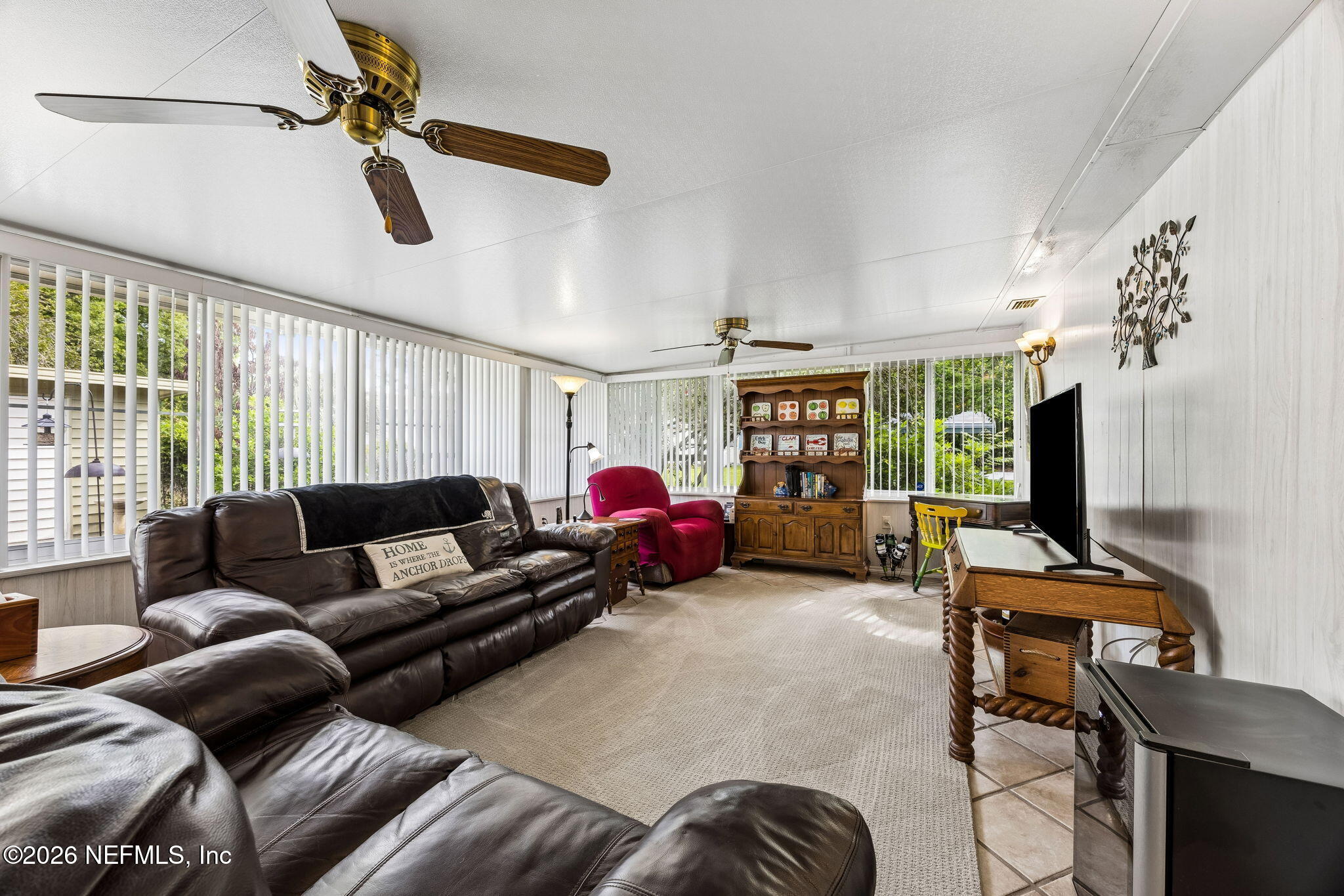 110 Shaffer Avenue Crescent City, FL 32112 - Photo 4 of 44 a living room with furniture and a flat screen tv