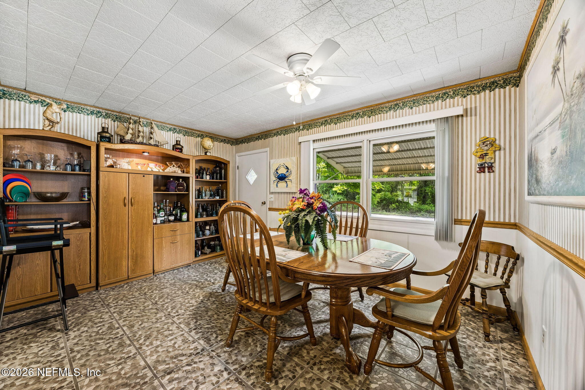 110 Shaffer Avenue Crescent City, FL 32112 - Photo 5 of 44 a view of a dining room with furniture window and outside view
