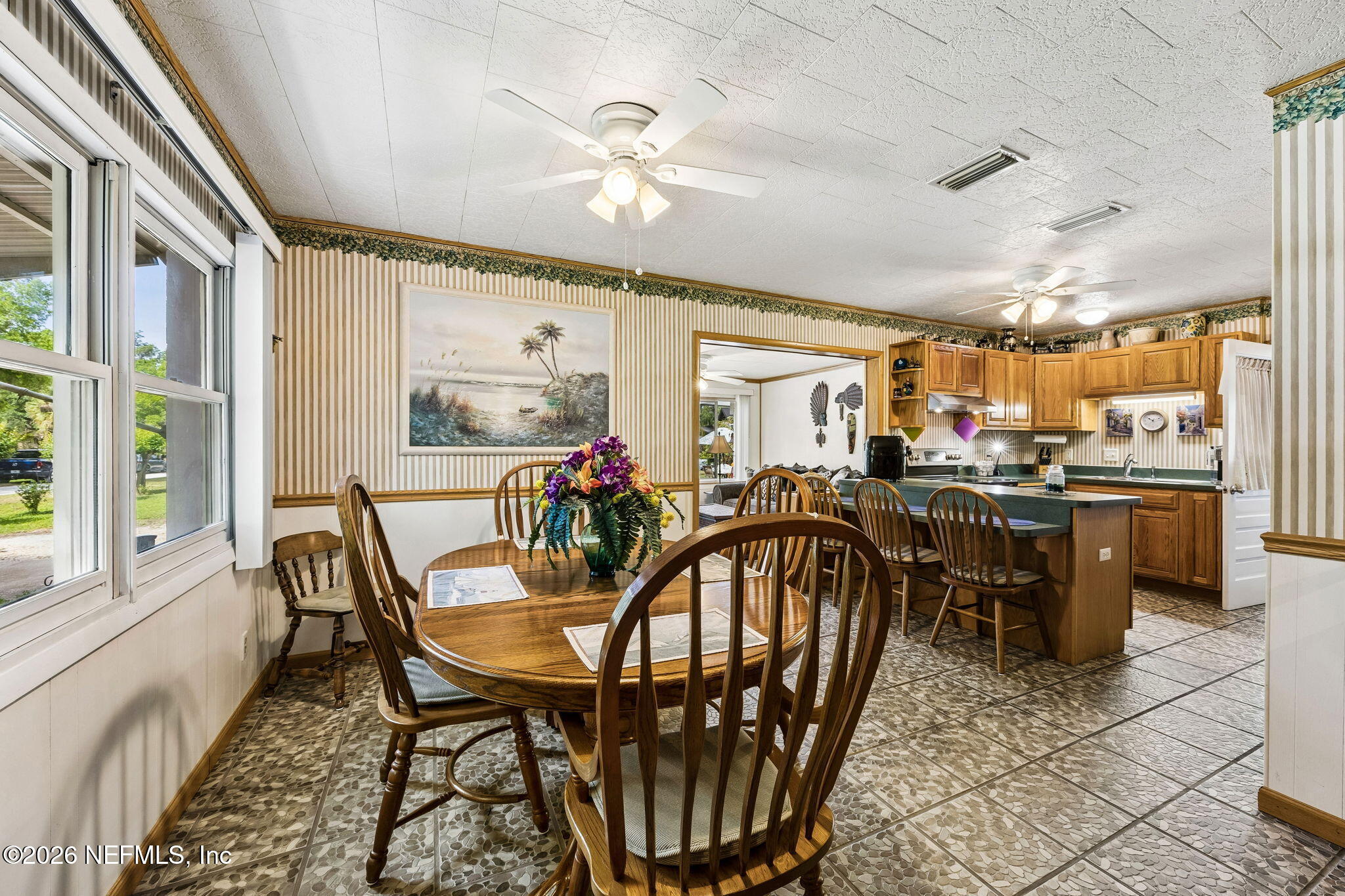 110 Shaffer Avenue Crescent City, FL 32112 - Photo 6 of 44 a view of a dining room with furniture and a chandelier