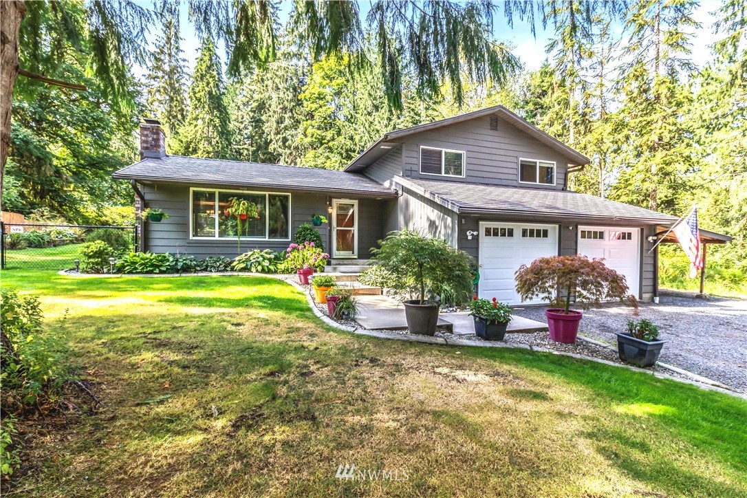 6218 Robe Menzel Road Granite Falls, WA 98252 - Photo 1 of 37 a front view of house with yard and green space