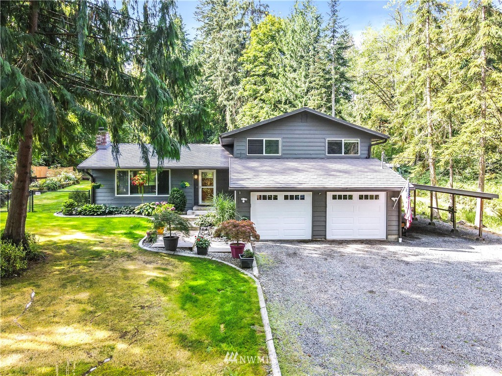6218 Robe Menzel Road Granite Falls, WA 98252 - Photo 2 of 37 a front view of house with yard and seating area
