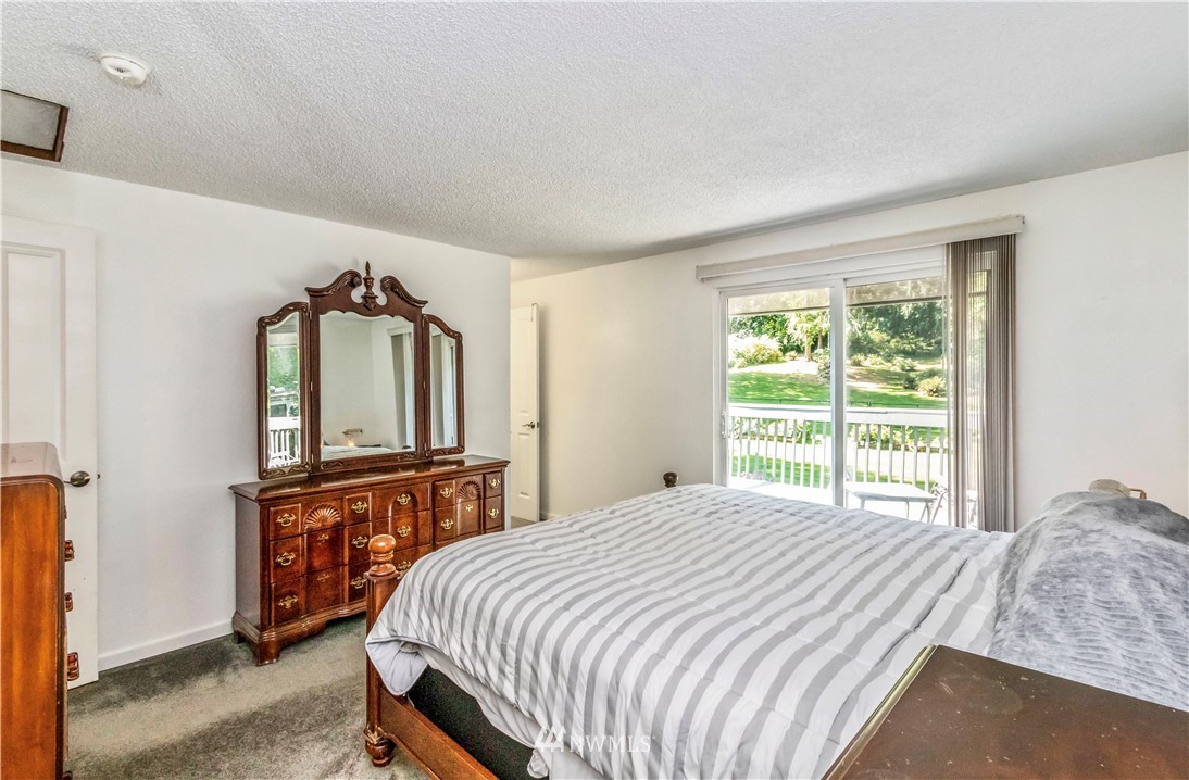 6218 Robe Menzel Road Granite Falls, WA 98252 - Photo 26 of 37 a bedroom with a bed a dresser and a window