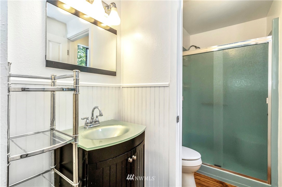 6218 Robe Menzel Road Granite Falls, WA 98252 - Photo 29 of 37 a bathroom with a sink a toilet a mirror and shower
