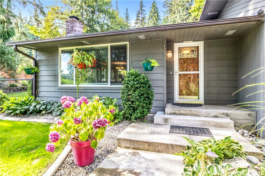 6218 Robe Menzel Road Granite Falls, WA 98252 - Photo 4 of 37 a front view of a house with flower garden