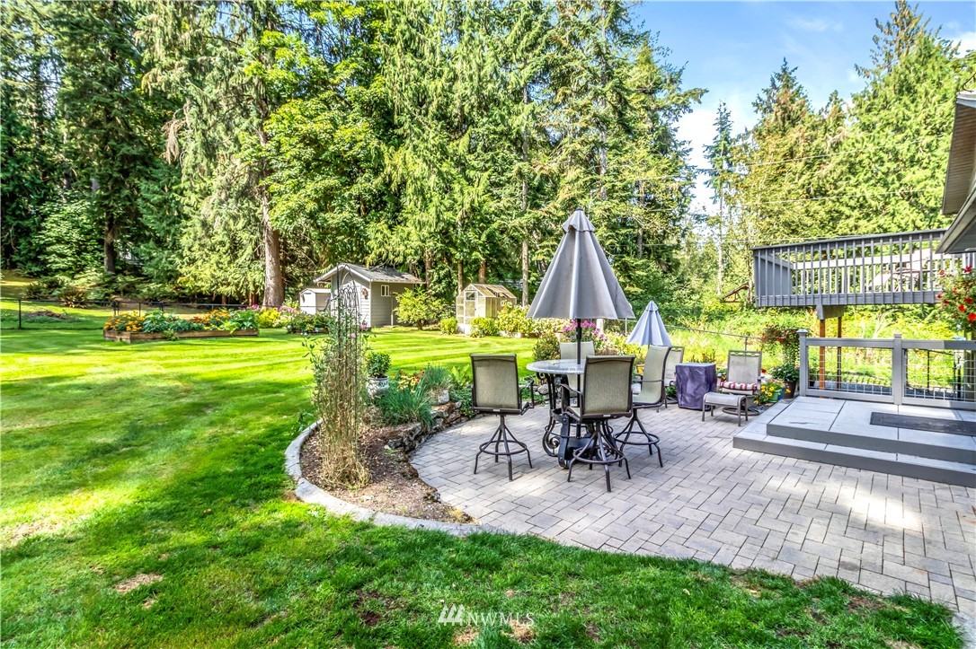 6218 Robe Menzel Road Granite Falls, WA 98252 - Photo 9 of 37 a swimming pool with outdoor seating and yard