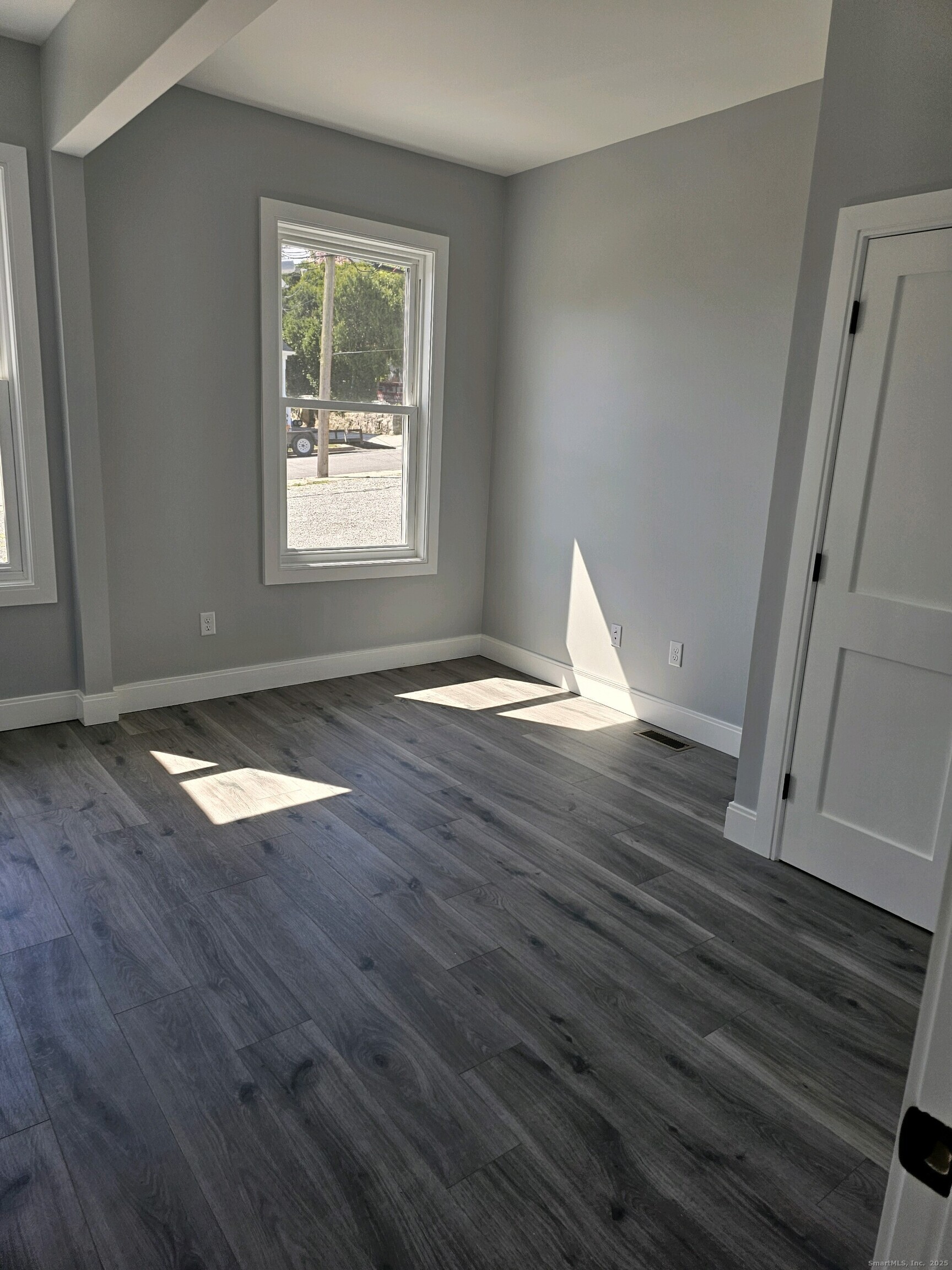 281 Pequot Avenue, Unit 2 New London, CT 06320 - Photo 13 of 21 a view of empty room with wooden floor and window