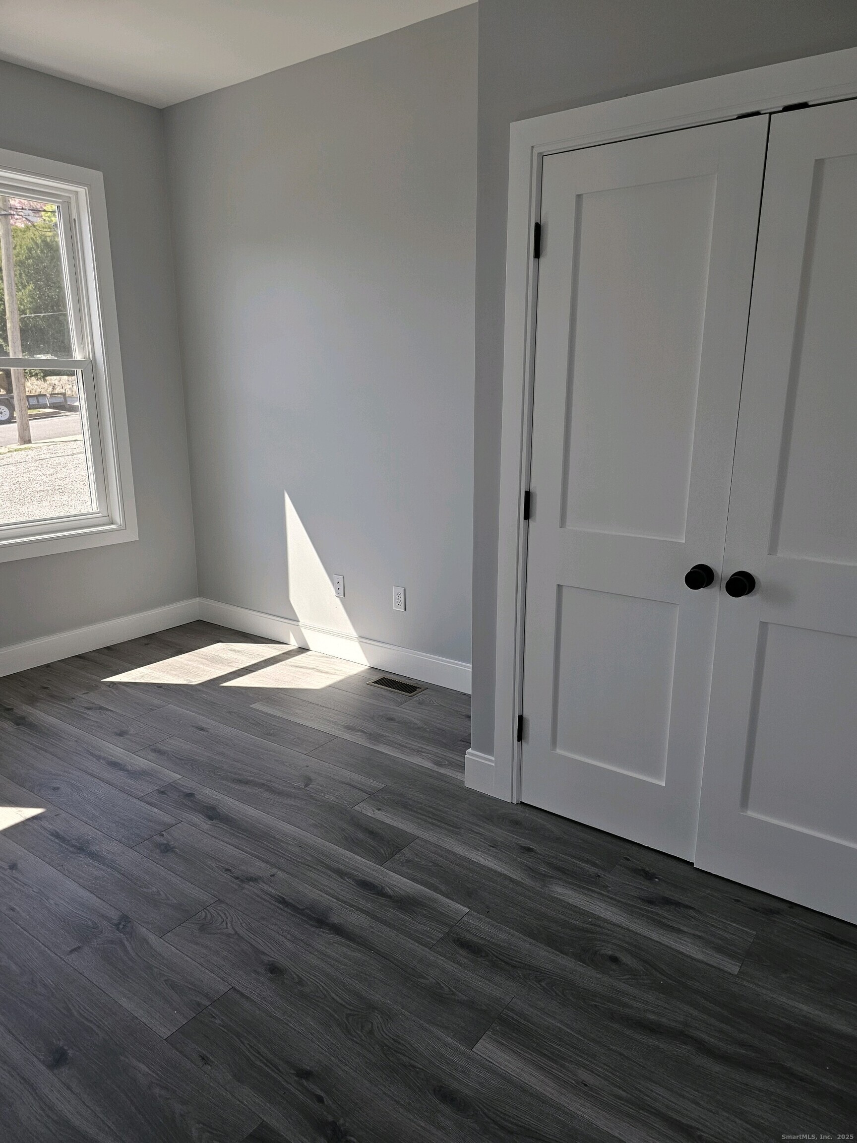 281 Pequot Avenue, Unit 2 New London, CT 06320 - Photo 14 of 21 wooden floor in an empty room
