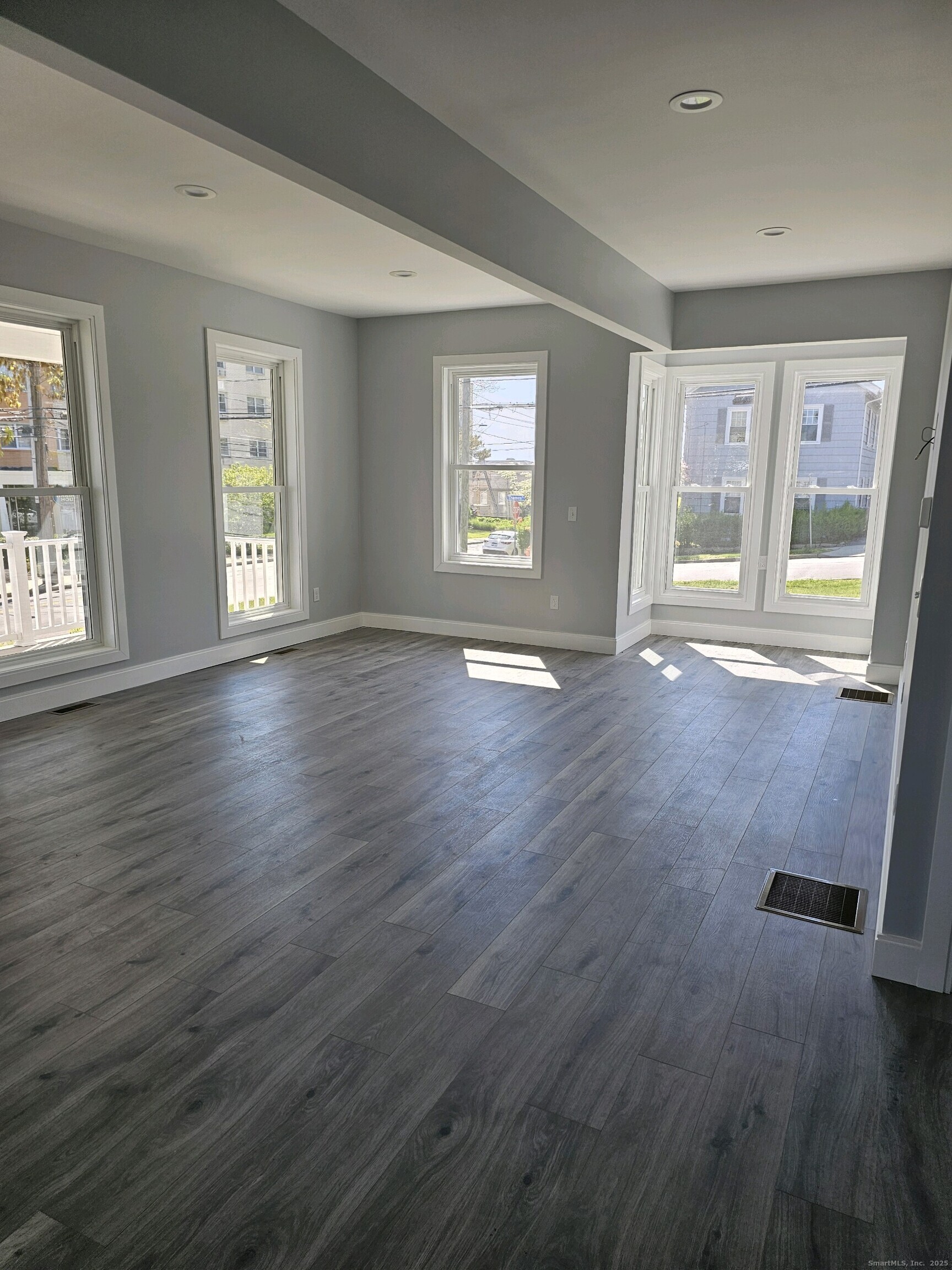 281 Pequot Avenue, Unit 2 New London, CT 06320 - Photo 19 of 21 a view of an empty room with wooden floor and a window