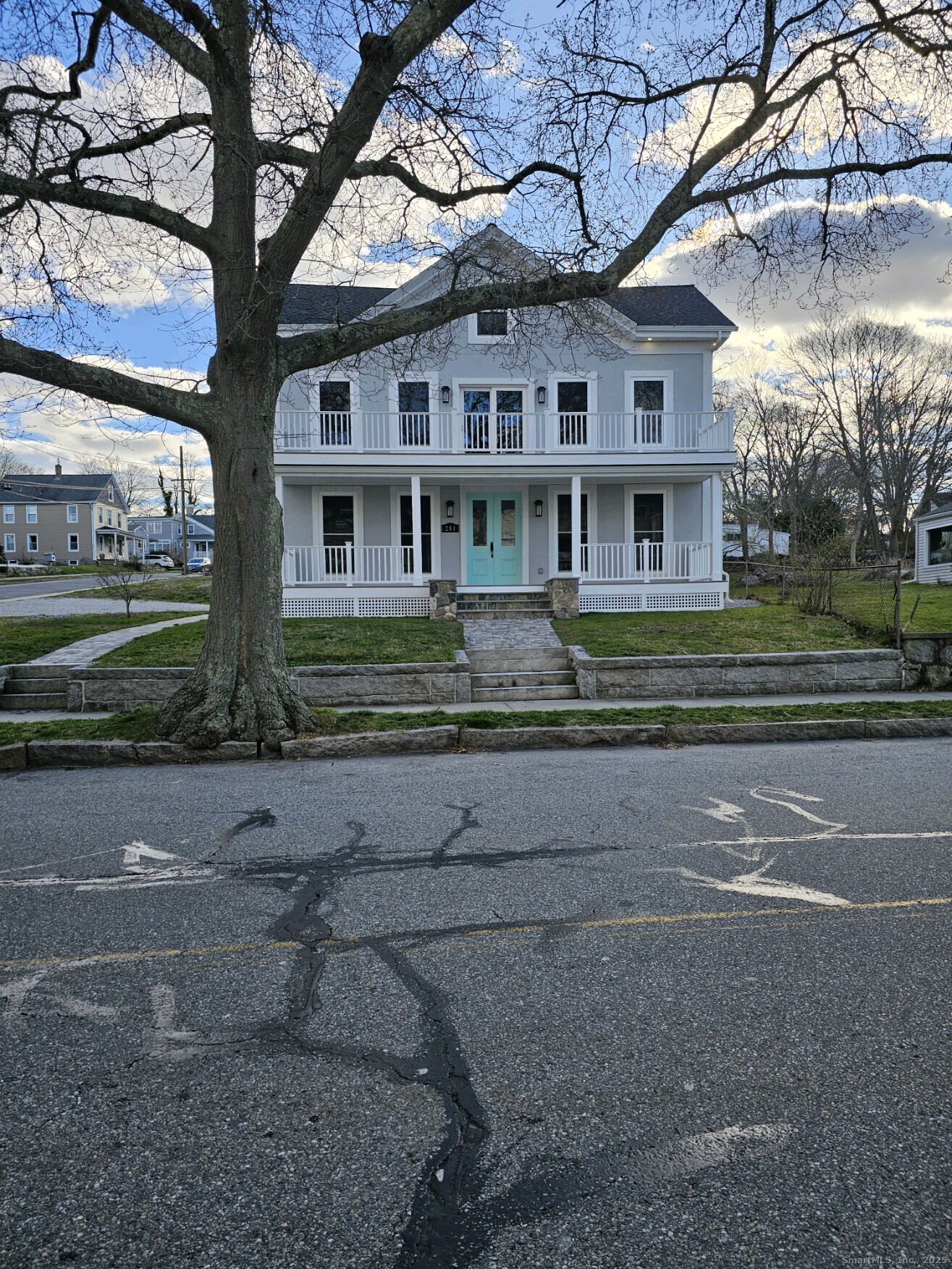 281 Pequot Avenue, Unit 2 New London, CT 06320 - Photo 2 of 21 a front view of a house with a garden