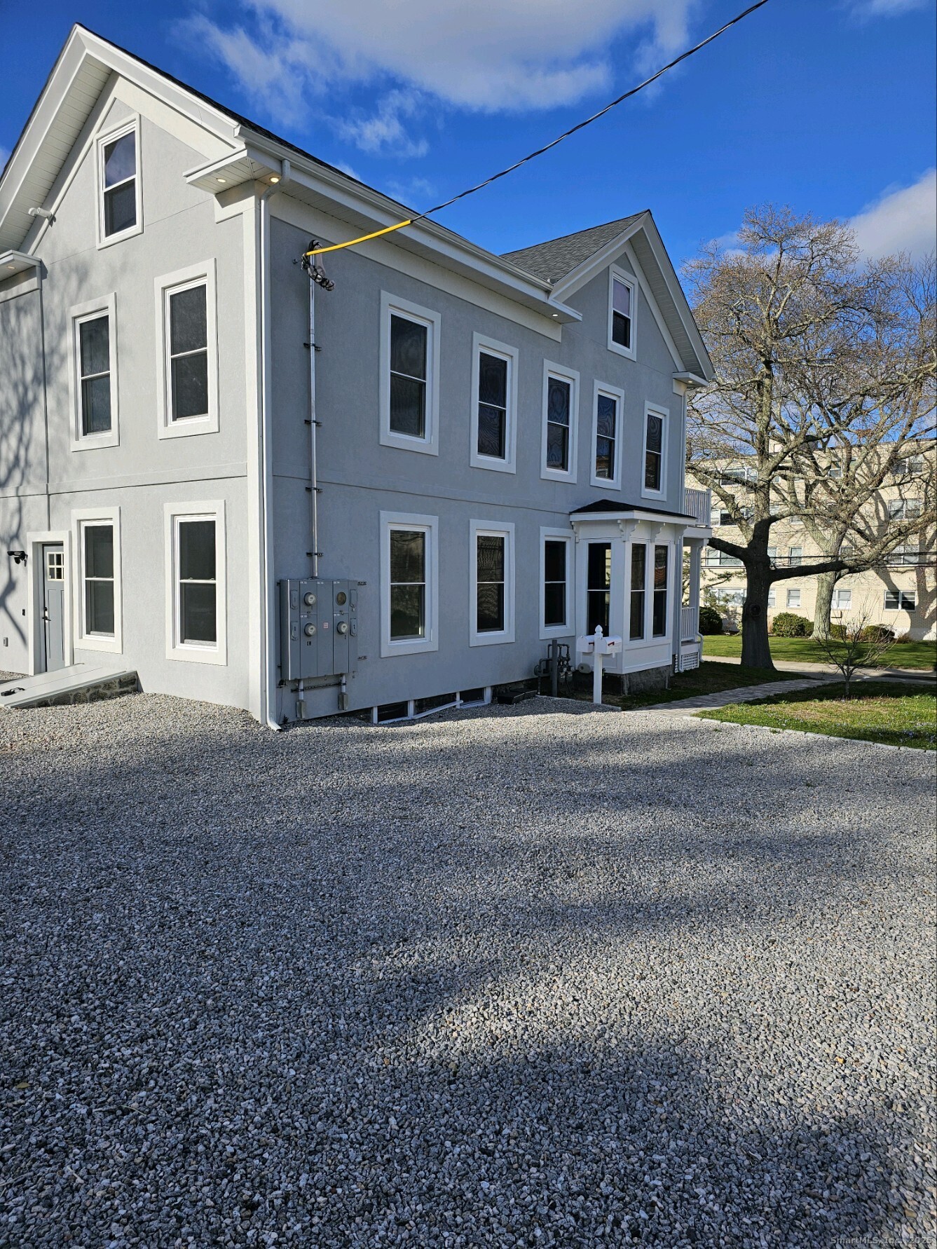 281 Pequot Avenue, Unit 2 New London, CT 06320 - Photo 3 of 21 a front view of a house with a yard