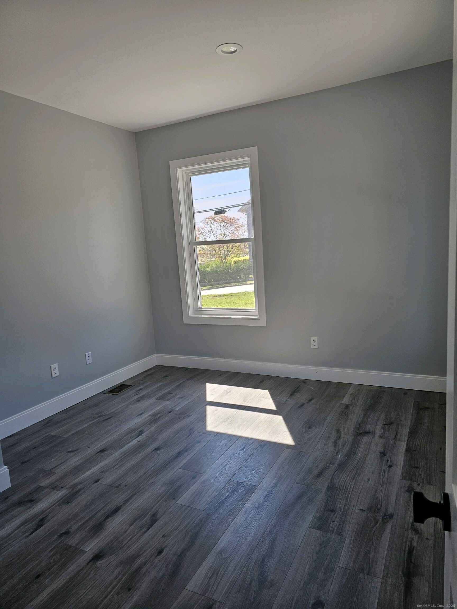 281 Pequot Avenue, Unit 2 New London, CT 06320 - Photo 7 of 21 a view of wooden floor and windows in a room