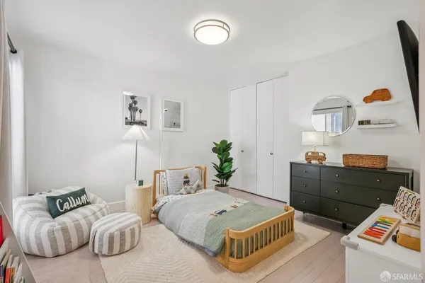 a bedroom with a bed and window