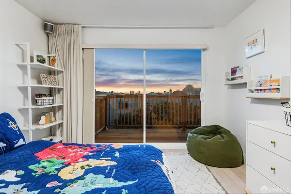 a bedroom with a bed and a bookshelf