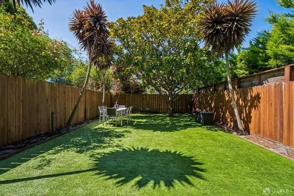 a garden with wooden fence