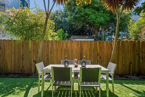 a view of outdoor dining space with a patio and a garden