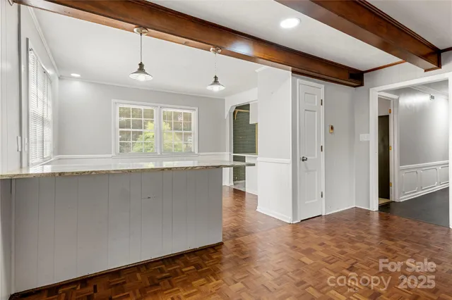 a view of a kitchen with a sink and a window