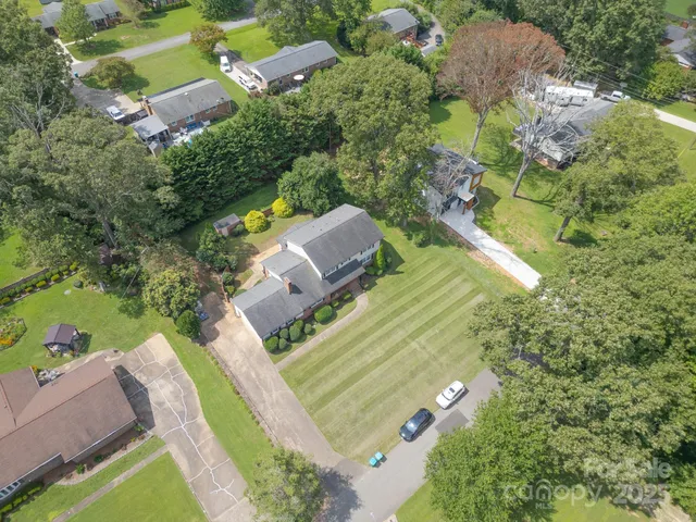 an aerial view of a house with a garden