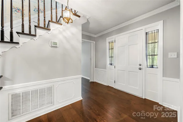 an entryway with wooden floor
