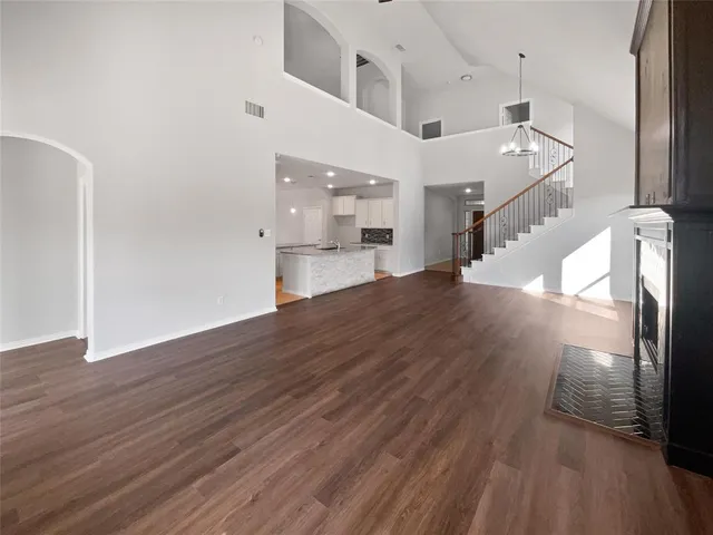 a view of a room with wooden floor