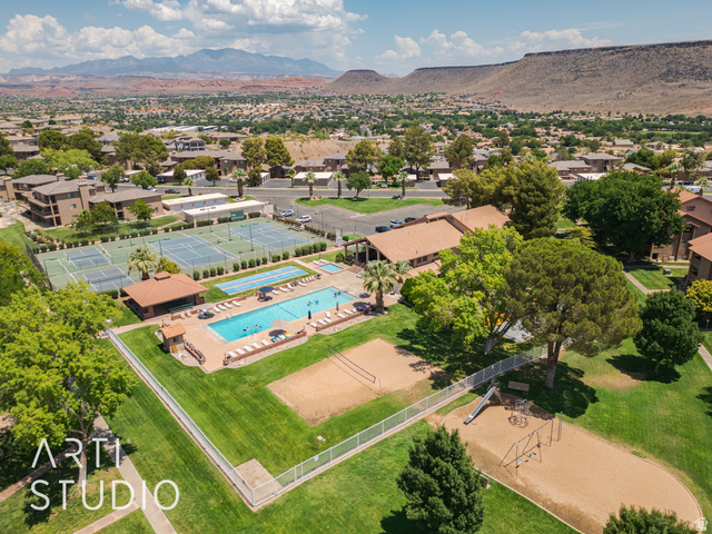 860 South Village Road, Unit A6 St. George, UT 84770 - Photo 35 of 41 Drone / aerial view of a pool and a mountainous background