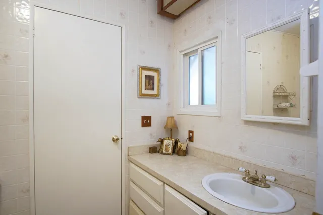 a bathroom with a sink and a mirror