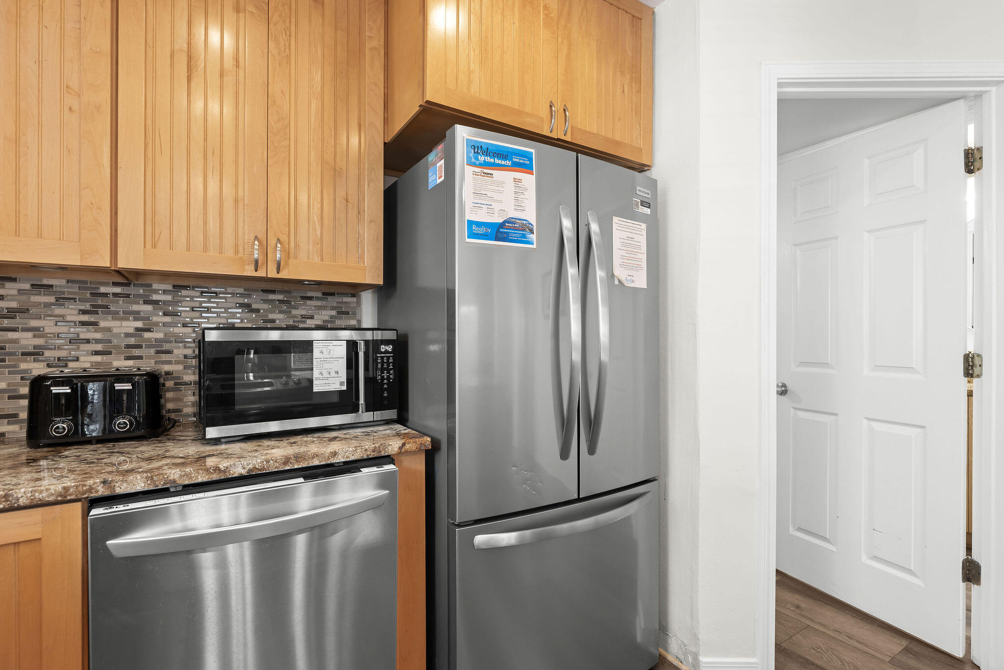 91 Matthew Boulevard Destin, FL 32541 - Photo 25 of 85 a metallic refrigerator freezer sitting in a kitchen